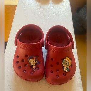 Red crocs with charms size 4